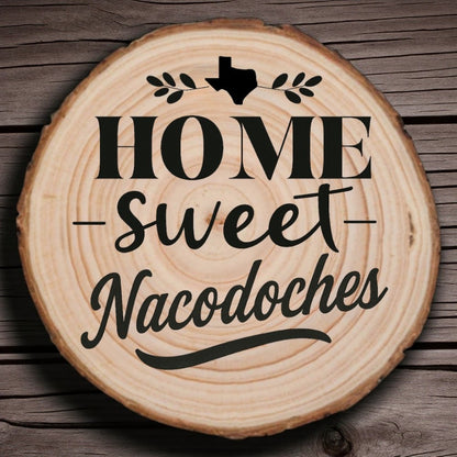Rustic wood slice coaster with “Home Sweet Nacogdoches” laser engraving, Texas silhouette, and leafy accents on wood background.