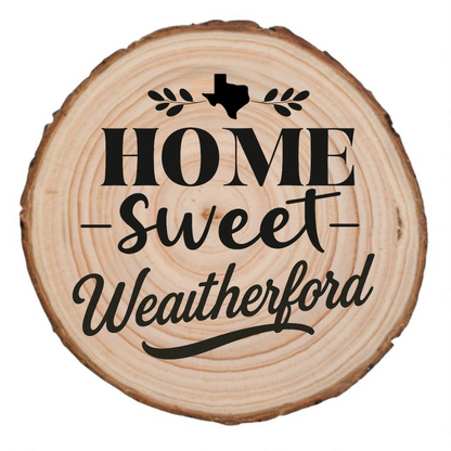 Natural wood slice coaster with “Home Sweet Weatherford” laser engraving and Texas silhouette on white background.