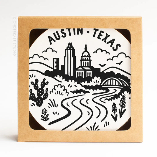 Austin Texas skyline letterpress coaster set featuring the Austin city skyline, styled as a Texas-themed home gift on the Texas Gift Baskets storefront