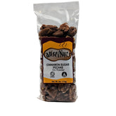 Clear bag of AustiNuts cinnamon sugar pecans, dry roasted, 4 oz package with visible pecans and front label