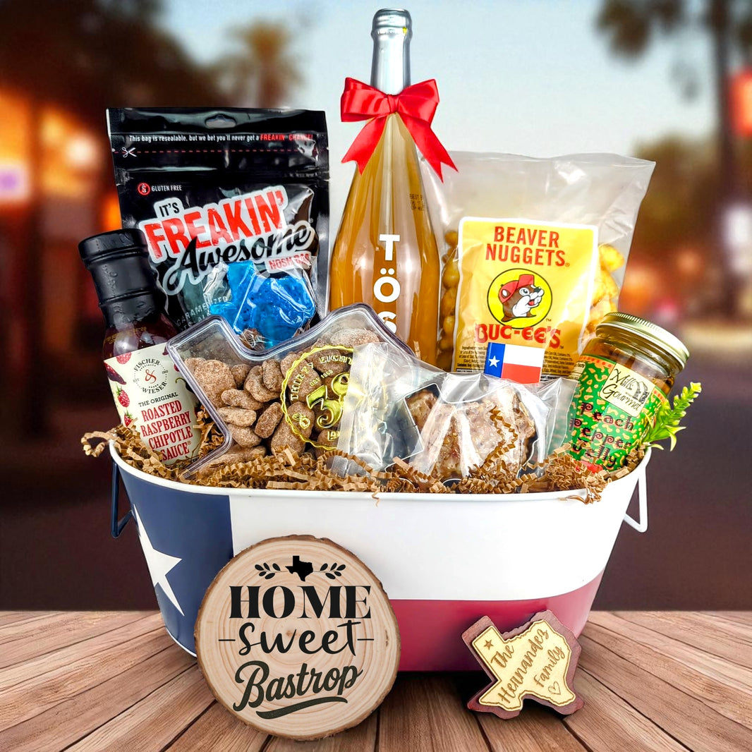 Bastrop Texas Toast & Treats Home Basket with TÖST ROSÉ, Peach Pepper Jelly, Buc-ee’s Beaver Nuggets, Texas pecans, praline, chipotle sauce, and Texas flag tin