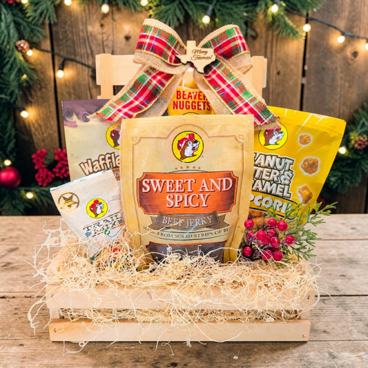 Buc-ee’s Merry Texmas Snack Crate with five Buc-ee’s snacks in a wooden pin crate