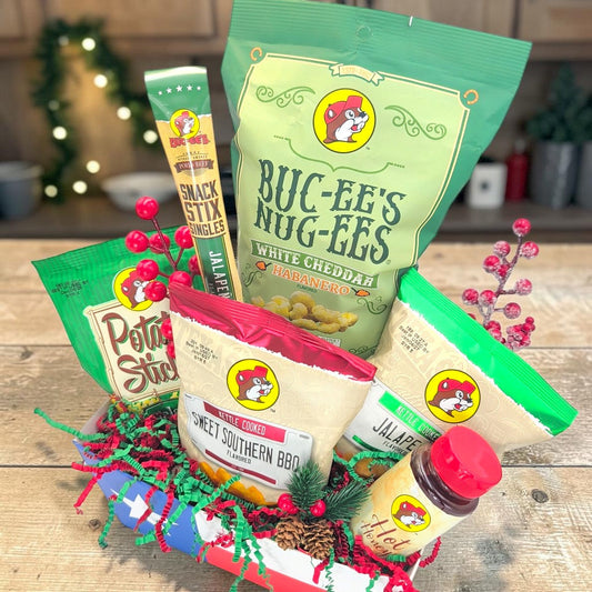 Buc-ee’s Spicy Christmas Crunch, angled view of six Buc-ee’s snacks in festive Texas flag tray