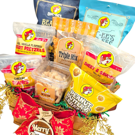 Angled view of Buc-ee’s Texmas Munch Basket with popcorn, pretzels, cookies and festive Christmas accents
