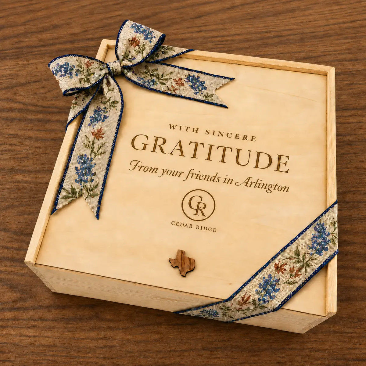 Cedar Ridge wooden corporate gift box engraved With Sincere Gratitude from your friends in Arlington and tied with a bluebonnet ribbon
