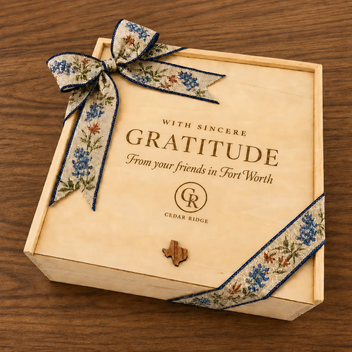 Cedar Ridge wooden corporate gift box engraved With Sincere Gratitude from your friends in Fort Worth and tied with a bluebonnet ribbon