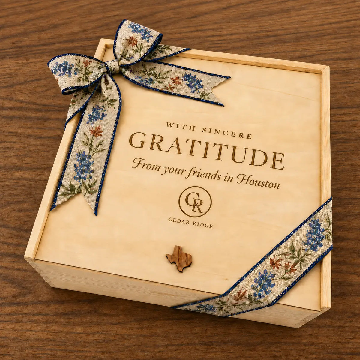 Cedar Ridge wooden corporate gift box engraved With Sincere Gratitude from your friends in Houston and tied with a bluebonnet ribbon