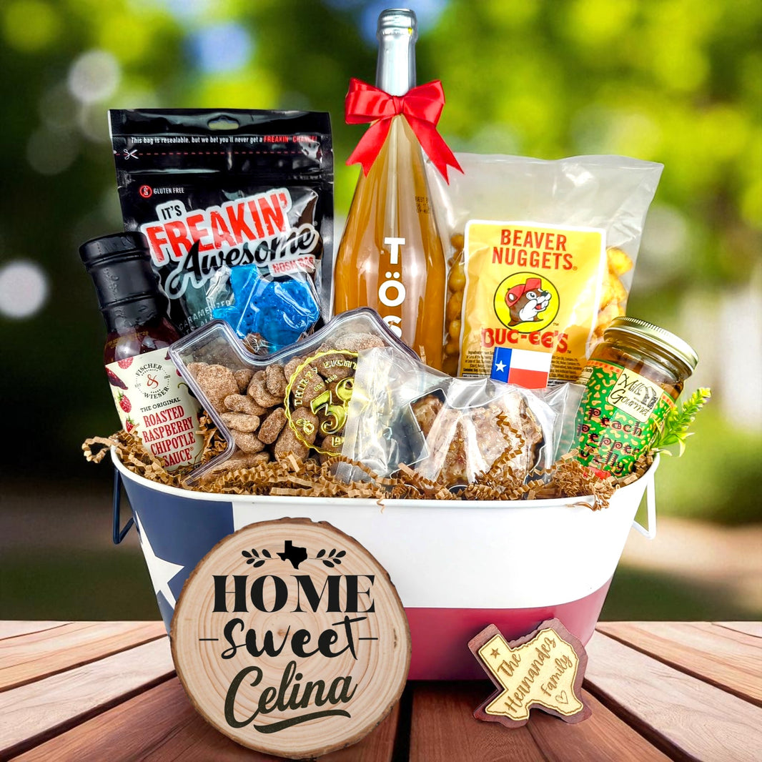 Celina Texas Home Celebration Toast & Treats basket with TÖST ROSÉ, Peach Pepper Jelly, Buc-ee’s Beaver Nuggets, Texas pecans, praline, chipotle sauce, and Texas flag tin