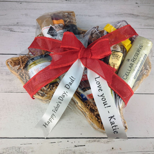 a texas-shaped gift basket filled with texas sourced products, with a large red burlap bow and custom printed ribbon