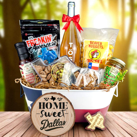 Dallas Texas Welcome Home Toast & Treats basket with TÖST ROSÉ, Peach Pepper Jelly, Buc-ee’s Beaver Nuggets, Texas pecans, praline, chipotle sauce, and Texas flag tin