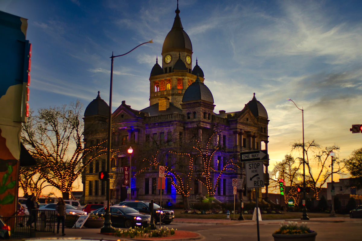Historic Denton County Courthouse-on-the-Square at dusk, representing the businesses Texas Gift Baskets serves in Denton.