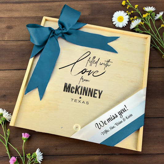 Wooden gift box with the phrase “Filled With Love from McKinney,” designed for filling with customizable Texas snacks, artisan treats, and thoughtful extras.