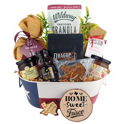 Frisco Morning Breakfast Basket on a white background, showcasing Texas Pecan Coffee, granola, cinnamon rolls, jalapeño cornbread mix, pecan apple butter, raw honey, and praline.
