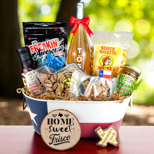 Frisco Texas Homestyle Toast & Treats Basket with TÖST ROSÉ, Peach Pepper Jelly, Buc-ee’s Beaver Nuggets, Texas pecans, praline, chipotle sauce, and Texas flag tin