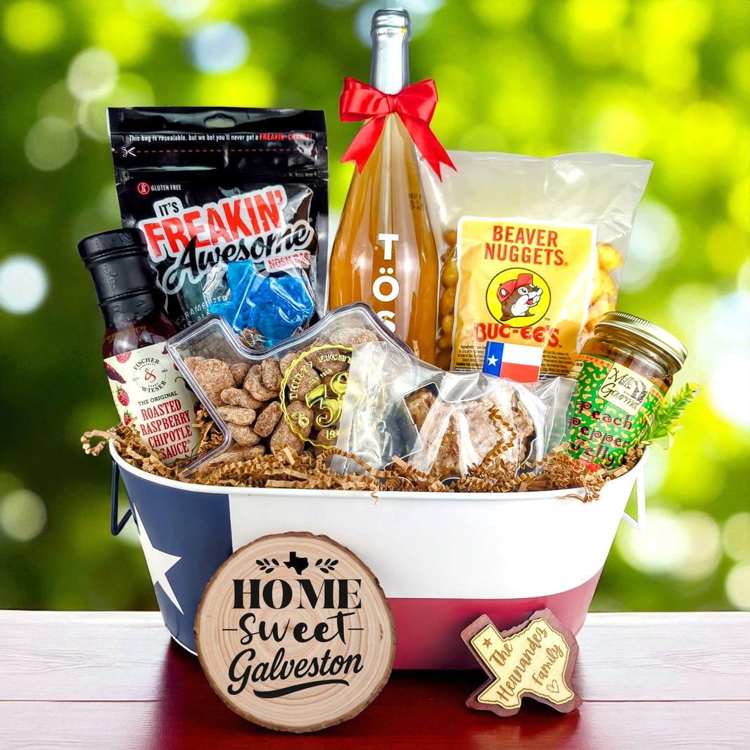 Galveston Texas Family Home Toast & Treats basket with TÖST ROSÉ, Peach Pepper Jelly, Buc-ee’s Beaver Nuggets, Texas pecans, praline, chipotle sauce, and Texas flag tin