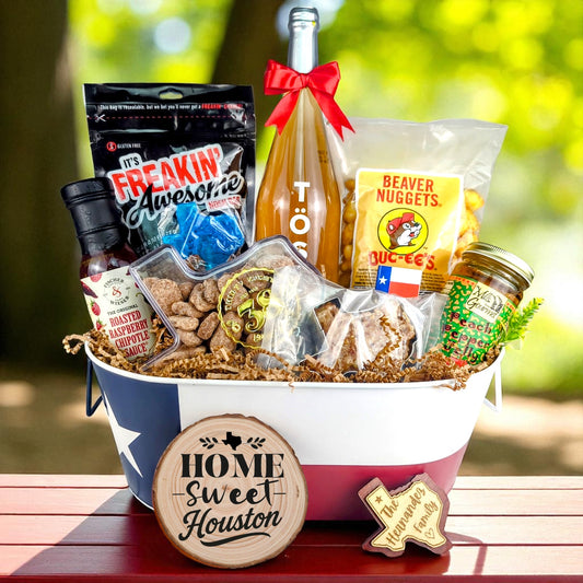 Houston Texas Toast & Treats Home Basket with TÖST ROSÉ, Peach Pepper Jelly, Buc-ee’s Beaver Nuggets, Texas pecans, praline, chipotle sauce, and Texas flag tin