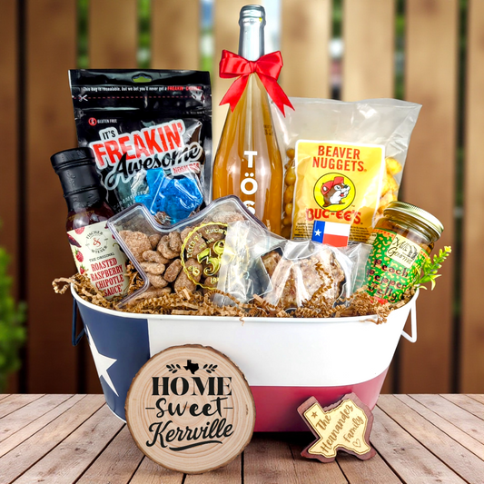 Kerrville Texas Home Toast & Treats basket with TÖST ROSÉ, Peach Pepper Jelly, Buc-ee’s Beaver Nuggets, Texas pecans, praline, chipotle sauce, and Texas flag tin