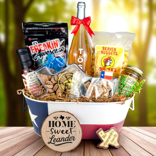 Leander Texas Homestyle Toast & Treats Basket with TÖST ROSÉ, Peach Pepper Jelly, Buc-ee’s Beaver Nuggets, Texas pecans, praline, chipotle sauce, and Texas flag tin