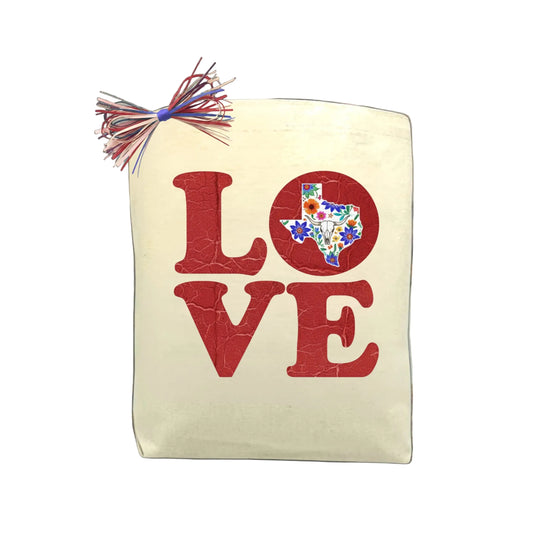 LOVE TEXAS canvas tote bag featuring a Texas-shaped wildflower design, a bold and reusable choice for thoughtful Texas gifts.