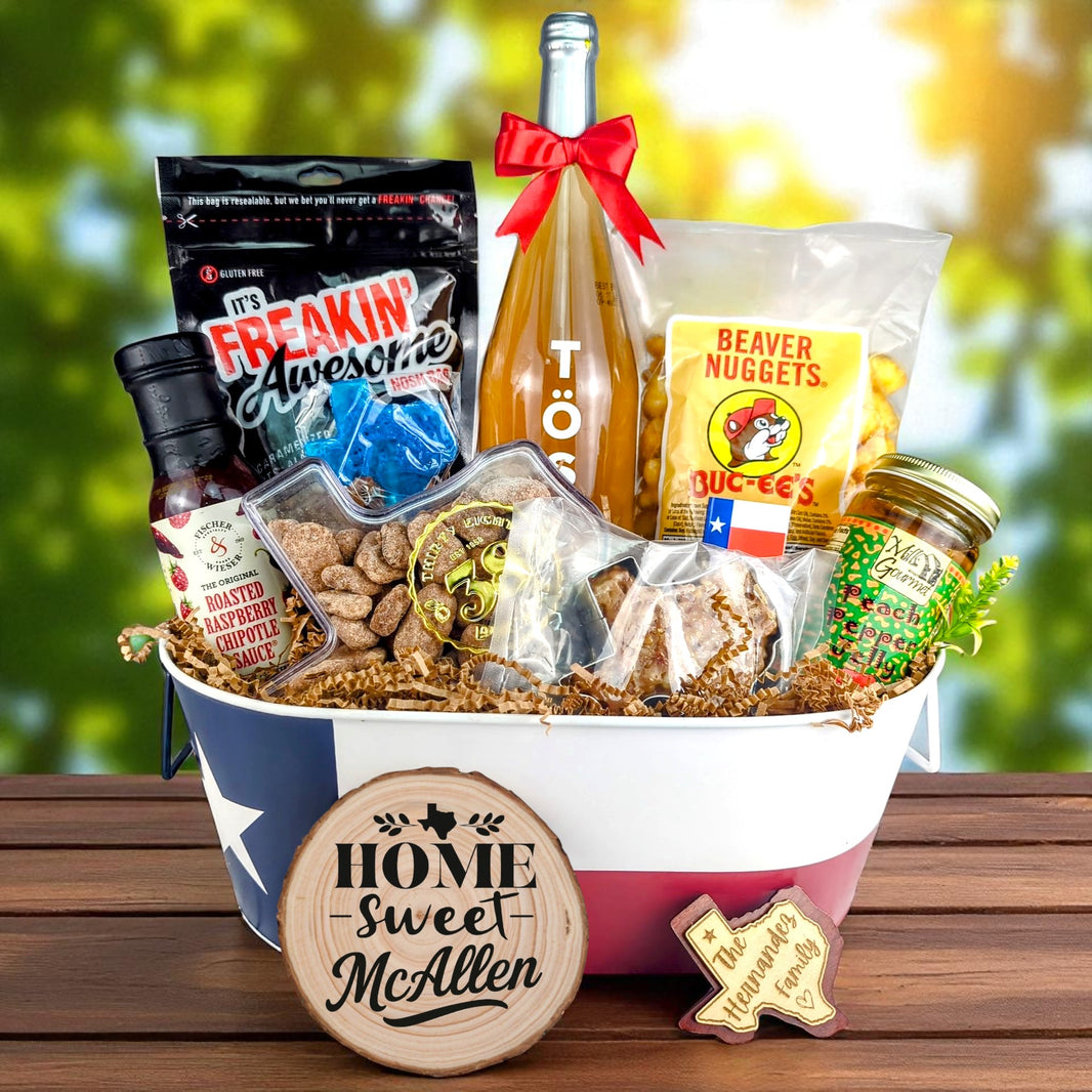 McAllen Texas Welcome Home Toast & Treats basket with TÖST ROSÉ, Peach Pepper Jelly, Buc-ee’s Beaver Nuggets, Texas pecans, praline, chipotle sauce, and Texas flag tin
