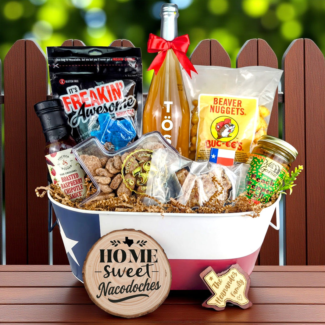 Nacogdoches Texas Home Toast & Treats basket with TÖST ROSÉ, Peach Pepper Jelly, Buc-ee’s Beaver Nuggets, Texas pecans, praline, chipotle sauce, and Texas flag tin