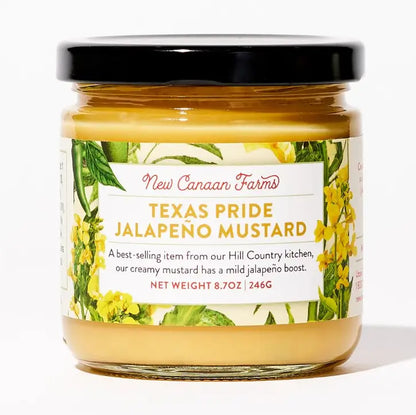 Jar of New Canaan Farms Texas Pride Jalapeño Mustard with a black lid and floral label, featuring a creamy Hill Country mustard with mild jalapeño flavor for Texas gift baskets and gourmet food collections.