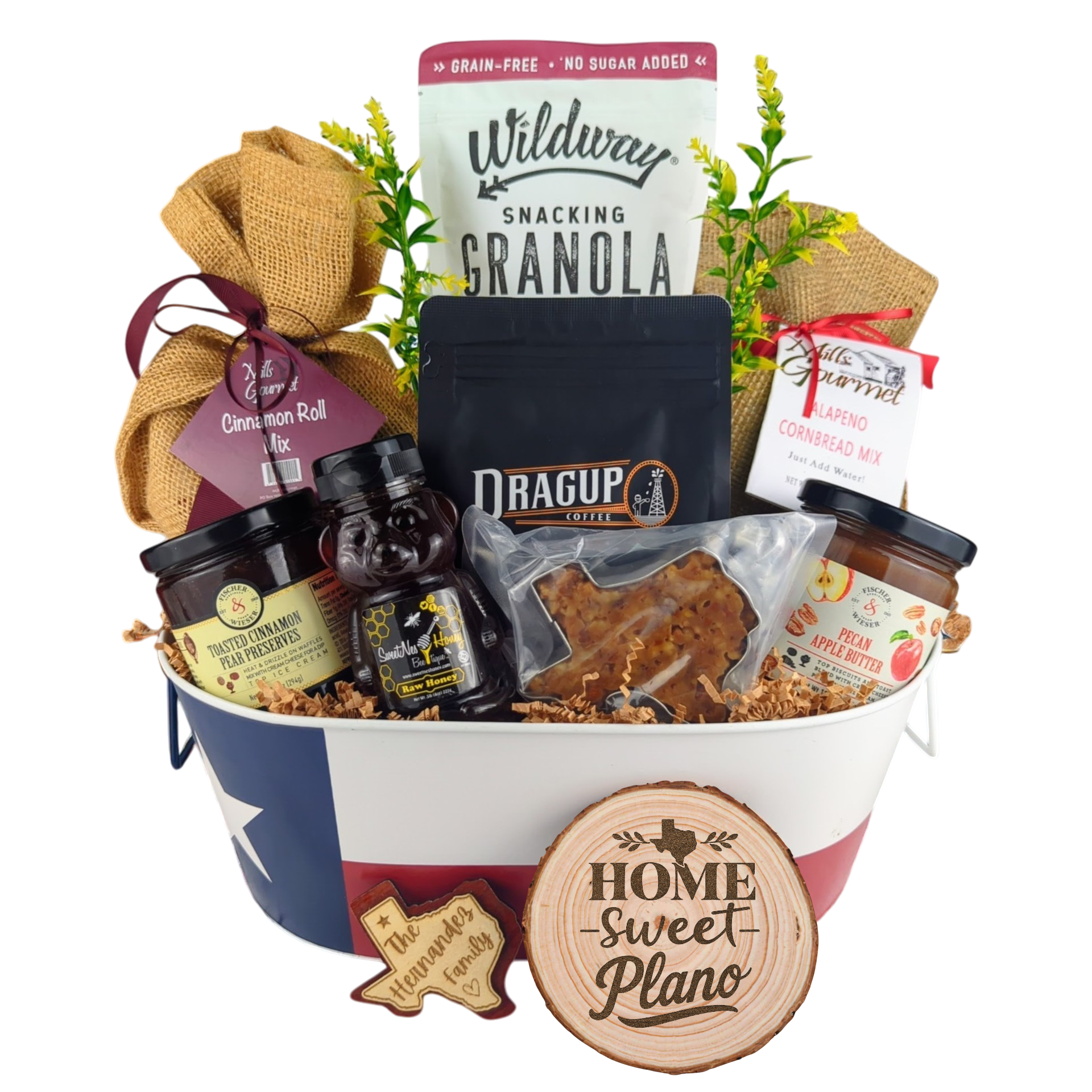 Plano Texas Breakfast Basket on a white background, showcasing pecan coffee, granola, cinnamon rolls, jalapeño cornbread mix, pecan apple butter, raw honey, and praline.