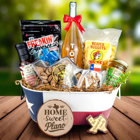 Plano Texas Toast & Treats Home Basket with TÖST ROSÉ, Peach Pepper Jelly, Buc-ee’s Beaver Nuggets, Texas pecans, praline, chipotle sauce, and Texas flag tin