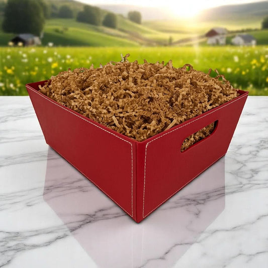 brown paper gift tray filled with paper shred, available to fill with Texas products and foods for a customized Texas-themed gift