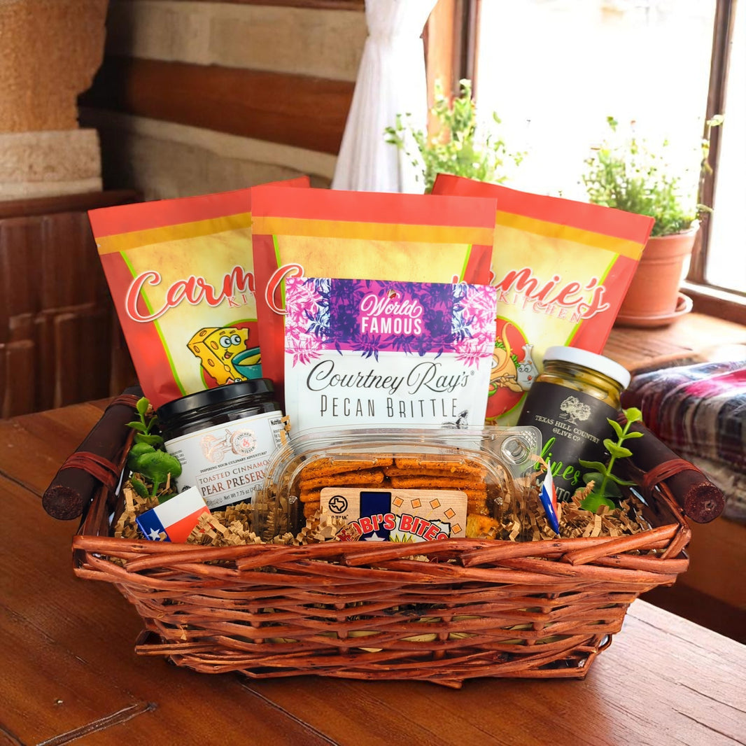 a texas themed gift basket with various snacks and treats on a wooden table, containing Texas soup, Texas olives, and Texas hill country preserves 