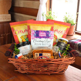 a texas themed gift basket with various snacks and treats on a wooden table, containing Texas soup, Texas olives, and Texas hill country preserves 
