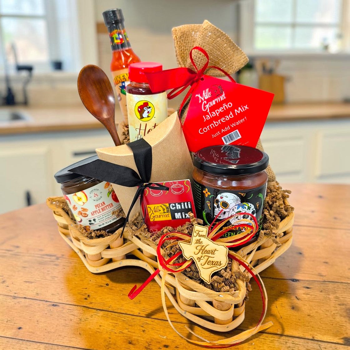 Texas Chili Supper Basket in a Texas-shaped basket with chili and cornbread mixes, hot honey, salsa, apple butter and wooden spoon