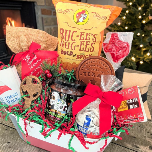Angled view of Texas Christmas Comforts with chili and cornbread mixes, salsa, snacks and Texas keepsakes
