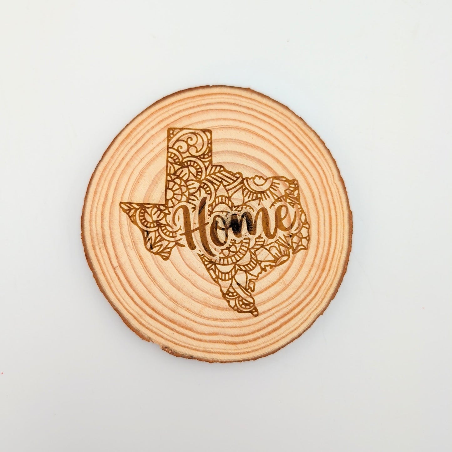 Texas home mandala wood slice coaster displayed as a rustic Texas-themed home gift from Texas Gift Baskets storefront