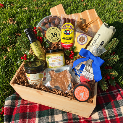 The Texas Rancher's Christmas Banquet Box in natural daylight with festive holly and a Christmas picnic setting