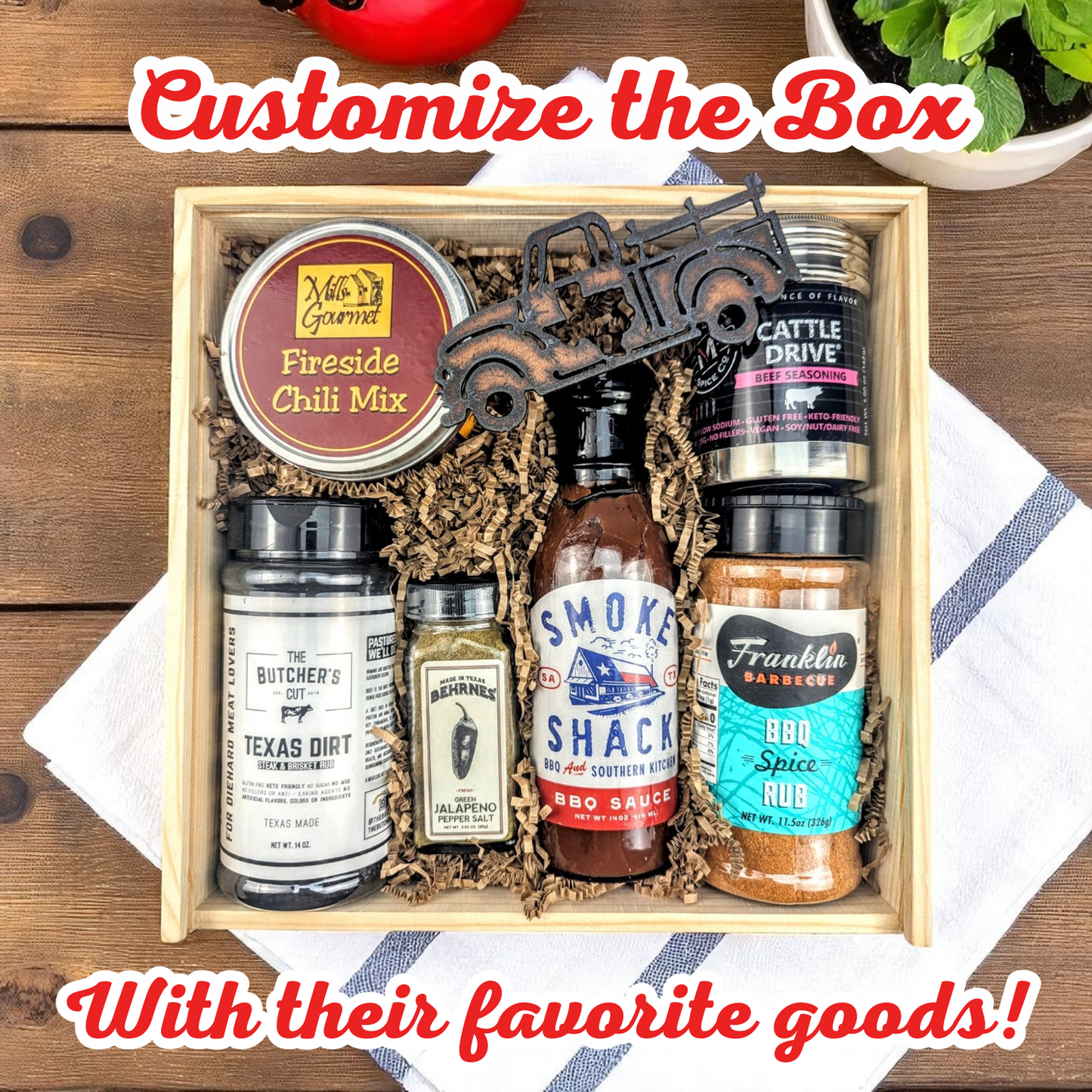 a wood texas themed bbq gift box with chili mix, a texas truck magnet, bbq seasoning, and bbq sauce
