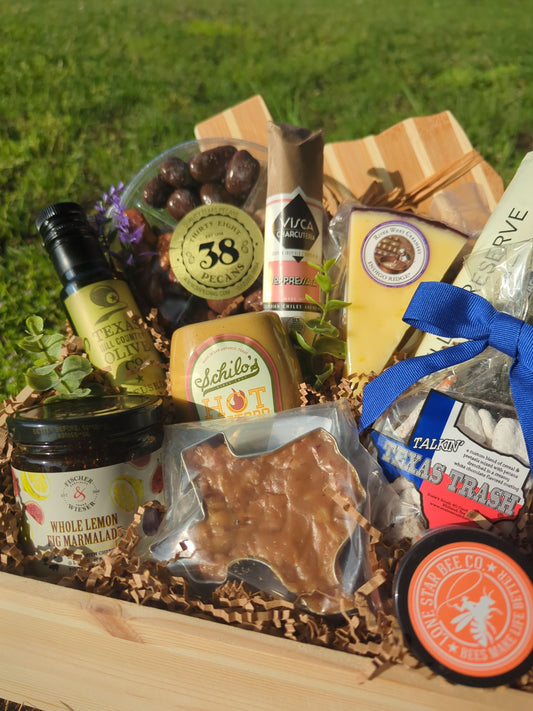a deluxe texas-themed and texas-sourced charcuterie wood gift box filled with gourmet Texas Food and Texas-shaped cheese board