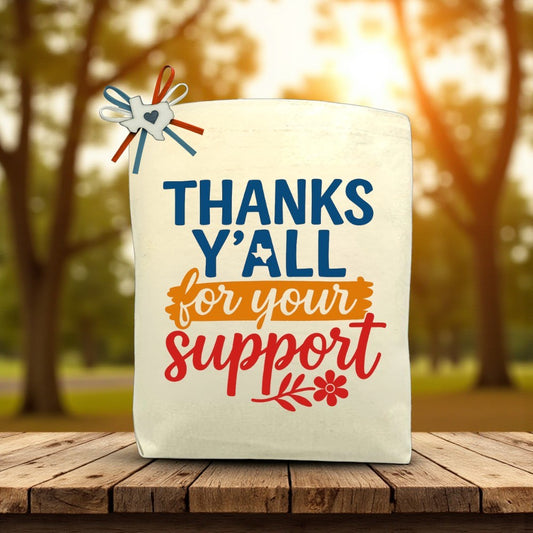 Canvas tote bag with the phrase “Thanks Y’all For Your Support,” perfect for filling with customizable Texas snacks, artisan treats, and thoughtful gifts.