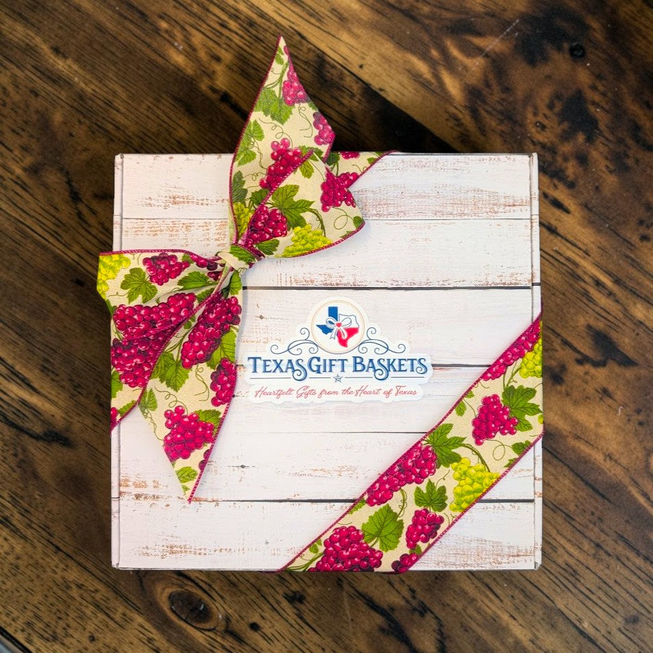 Hill Country Harvest Box closed and tied with a grapevine ribbon and Texas Gift Baskets seal
