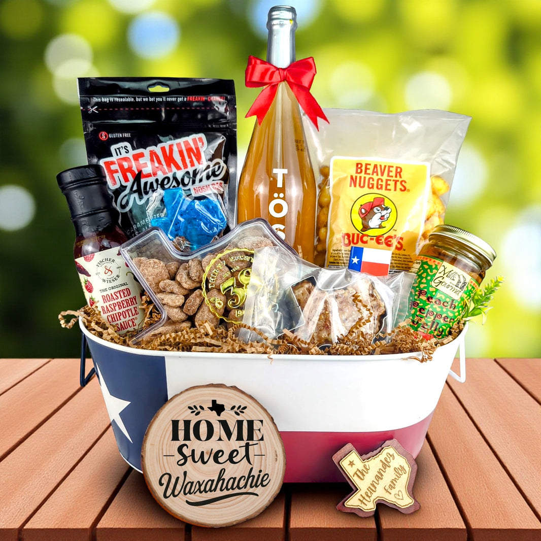 Waxahachie Texas Homestyle Toast & Treats basket with TÖST ROSÉ, Peach Pepper Jelly, Buc-ee’s Beaver Nuggets, Texas pecans, praline, chipotle sauce, and Texas flag tin