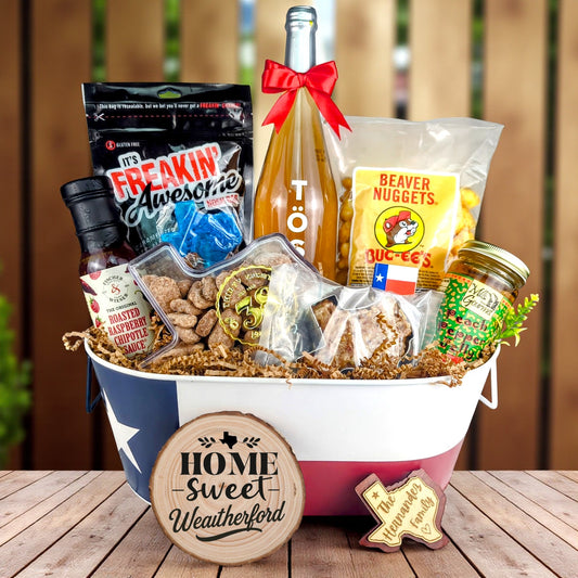 Weatherford Texas Family Home Toast & Treats basket with TÖST ROSÉ, Peach Pepper Jelly, Buc-ee’s Beaver Nuggets, Texas pecans, praline, chipotle sauce, and Texas flag tin