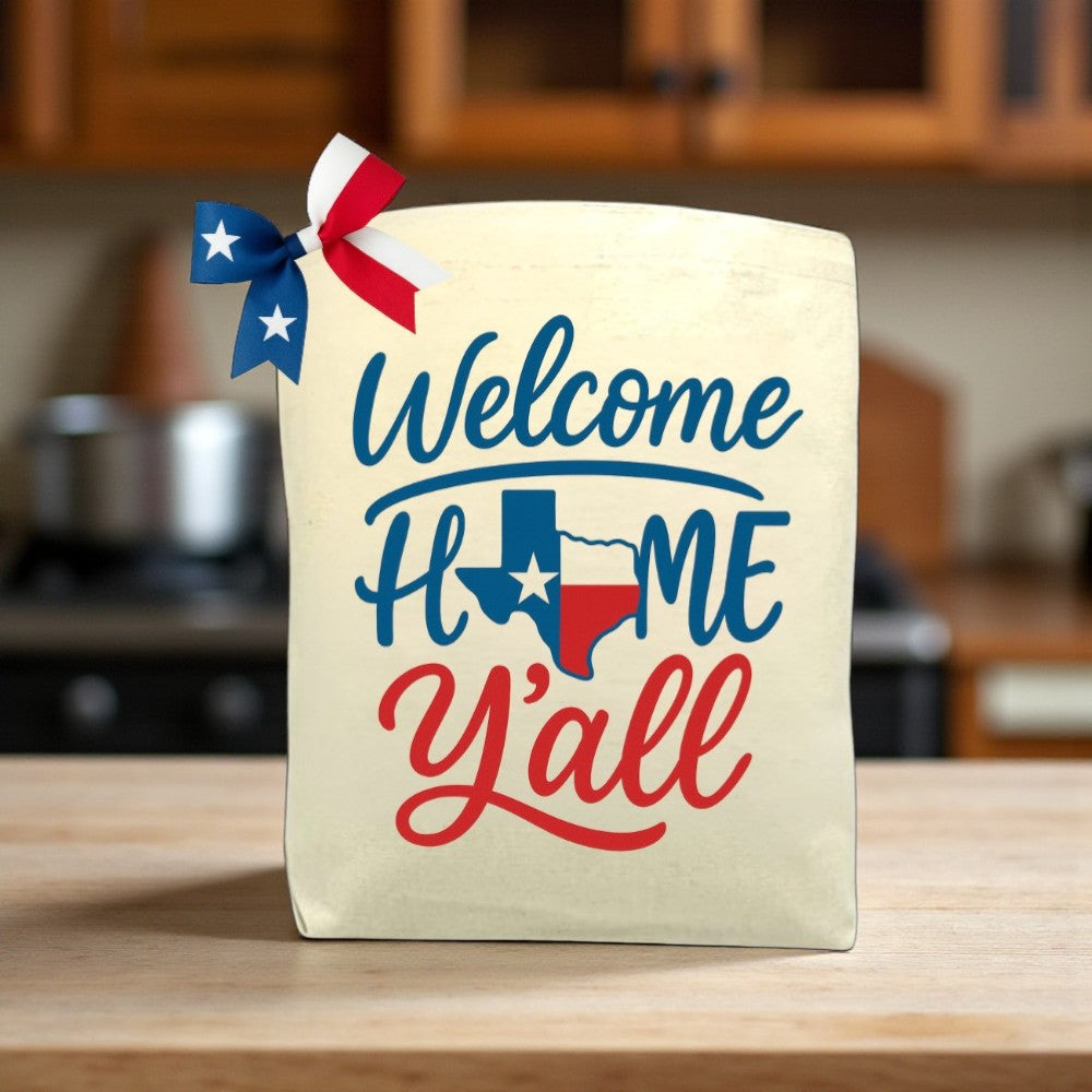 Welcome Home Y’all canvas tote bag with Southern-inspired design, perfect for housewarming or everyday use