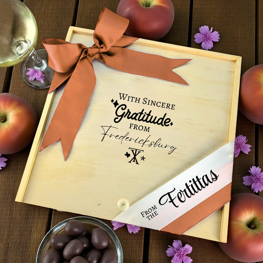 Wooden gift box with the phrase “With Sincere Gratitude from Fredericksburg,” designed for filling with customizable Texas snacks, artisan treats, and thoughtful extras.